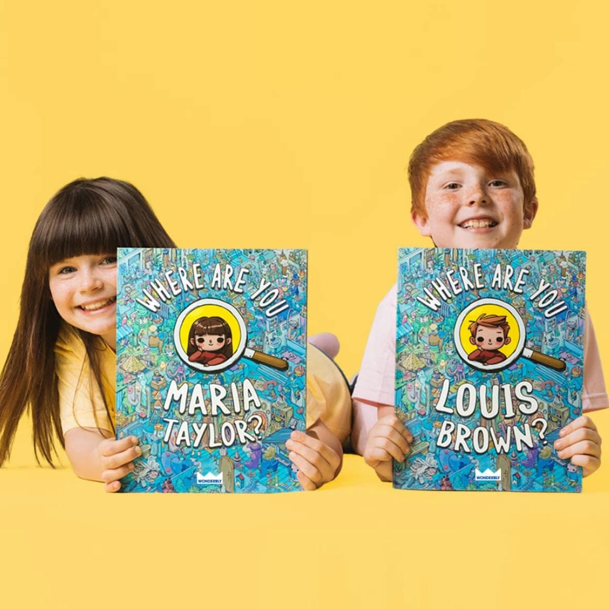 two kids holding the book